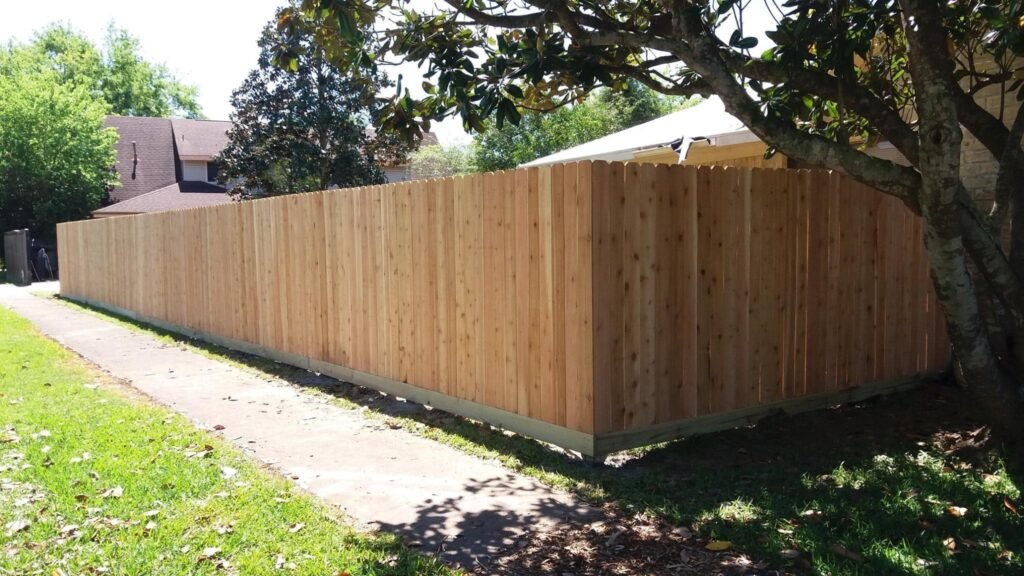 finished fence job with rot board