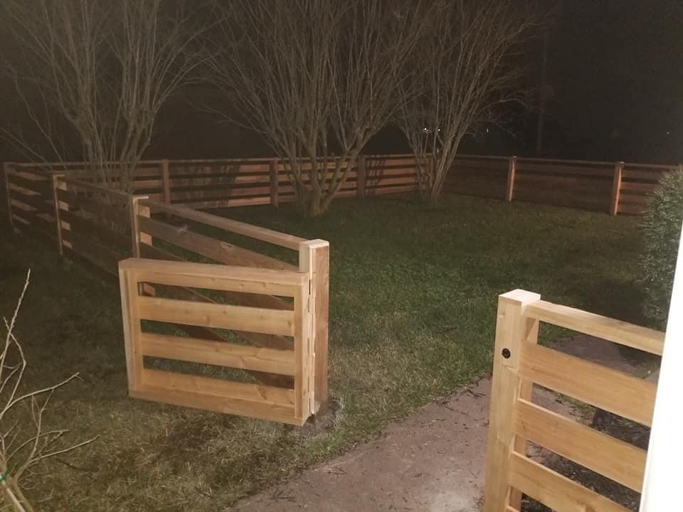 ranch style fence with open gate