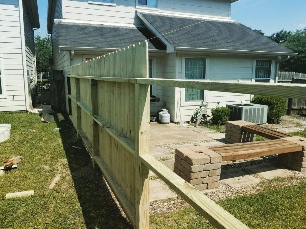 screwing pickets to fence frame